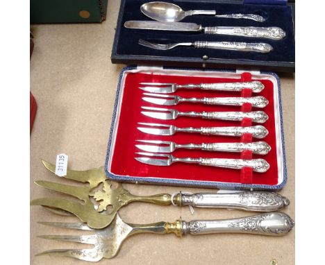 A cased set of 6 Old English pattern silver-handled cake knives, a cased plated 3-piece knife, fork and spoon set, and 2 Cont