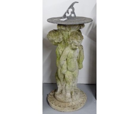 An embossed lead sundial on a concrete cherub design stand, H60cm 