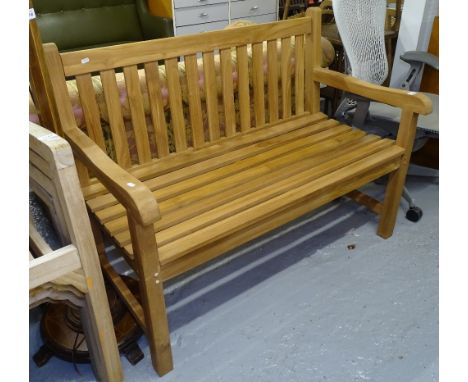 A teak slatted garden bench 