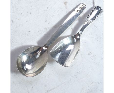A Georg Jensen sterling silver caddy spoon with rope edge pattern, dated 1924, and a Georg Jensen stylised silver dessert spo