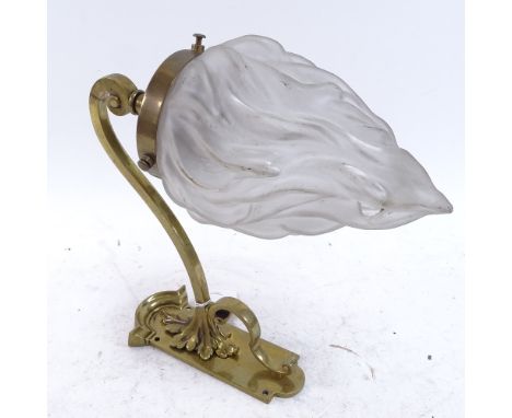 A 19th century brass wall-mounted light fitting, frosted glass flame design shade, plate bracket height 16cm 