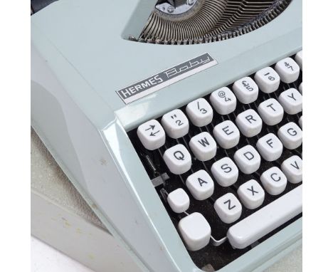 A Hermes Baby Portable Typewriter, barrel length 24cm 