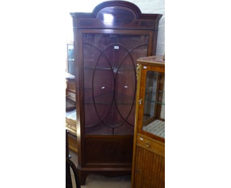 A late Victorian mahogany and satinwood-banded corner display cabinet, with lattice glazed panelled door, on bracket feet, W8