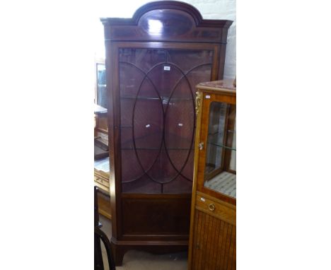 A late Victorian mahogany and satinwood-banded corner display cabinet, with lattice glazed panelled door, on bracket feet, W8