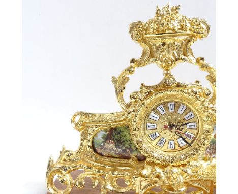 A modern brass quartz mantel clock, on shaped agate base, base length 40cm 