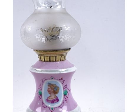 A 19th century pink and white ceramic oil lamp converted to candle holder, with frosted frilled glass shade, height 33cm 