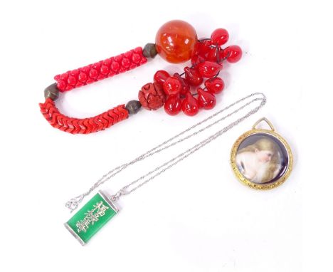 A Chinese sterling silver green stone pendant necklace, Chinese red bead and cinnabar bracelet etc (3) 