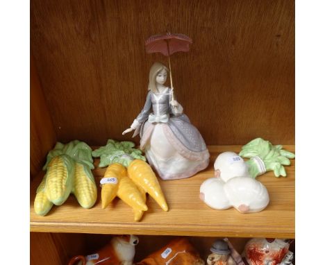 A Lladro porcelain woman with parasol, height 21cm, and 3 ceramic vegetable ornaments (4) 