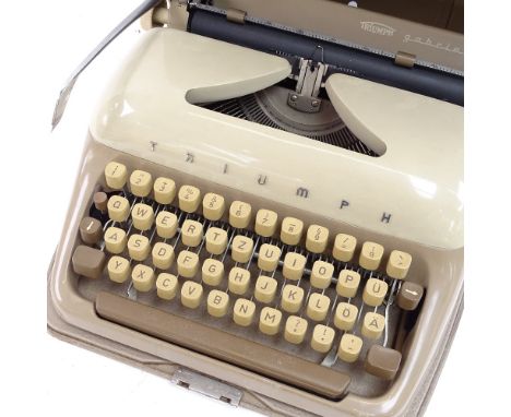 A Vintage Triumph Portable Typewriter, in original aluminium case, barrel length 24cm 