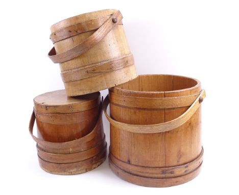 A set of 3 Vintage bentwood grain measures with swing handles, largest diameter 29cm (3) 