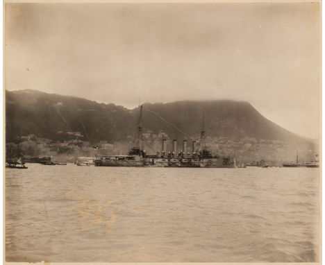 * Hong Kong. A view of Central, Hong Kong, with a British battleship in the foreground, c. 1902, vintage gelatin silver print
