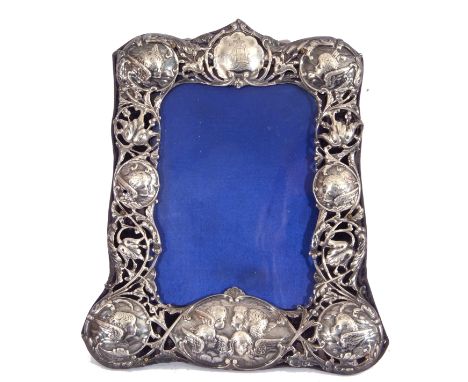 Late Victorian silver photograph frame with pierced and embossed border, decorated with cherubs, scrolls and flowers, London 