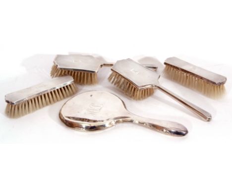 Matching silver backed dressing table wares to include two hairbrushes and two clothes brushes, Birmingham 1947, maker,s mark