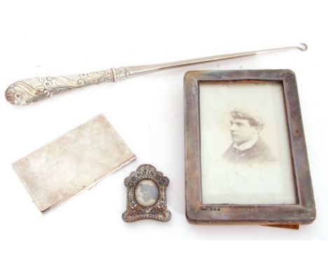 Mixed Lot: large Victorian handled button hook, London 1888, a silver photograph frame, Birmingham 1926, a silver plated card