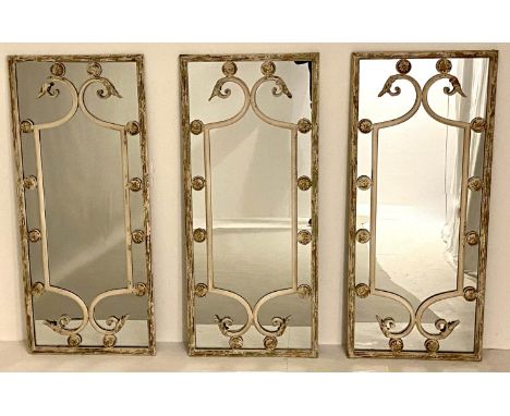 ARCHITECTURAL WALL MIRRORS, a set of three, 111cm x 48cm, aged metal frames. (3) 