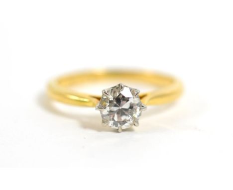 An old cut solitaire diamond ring, in claw setting, to tapered shoulders, estimated diamond weight carat approximately 0.65 c