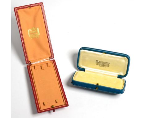 A 1920s Cartier fitted red leather case, for an item of jewellery and a Boucheron fitted stud case (2)