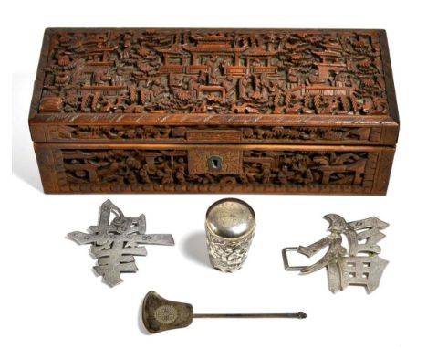 A Chinese silver buckle; a sifter spoon; a handle from a walking stick; together with a late 19th century carved box 