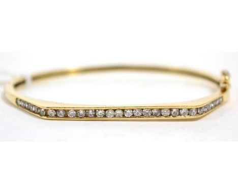 A 9 carat gold diamond bangle, total estimated diamond weight 0.85 carat approximately, measures 5cm by 6cm, 11.3g