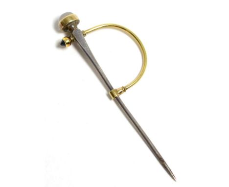 A moonstone and sapphire cloak pin, the top inset with a round moonstone, to a tapering pin and a swivel clasp inset with a s
