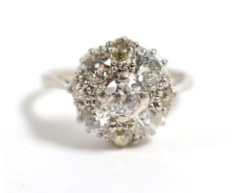 An old cut diamond cluster ring, total estimated diamond weight 1.50 carat approximately, finger size K, stamped 'PLATINUM', 