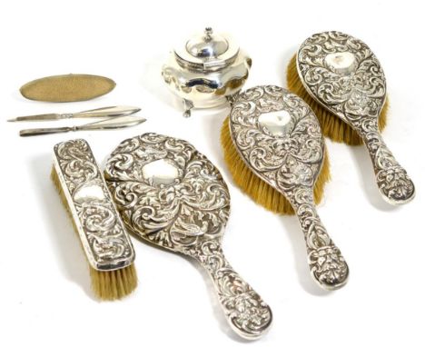 A silver caddy, Birmingham 1913; a silver part dressing table set Chester 1897; and a part manicure set 4.5ozt