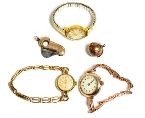 Two lady's 9 carat gold wristwatches, one signed Tudor; a plated lady's wristwatch signed Tissot; a Masonic gilt metal ball w