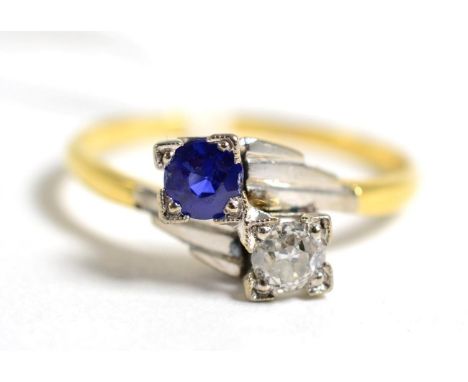 An Art Deco sapphire and diamond two stone crossover ring,l estimated diamond weight 0.20 carat approximately, finger size P1