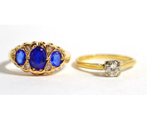 An 18 carat gold solitaire diamond ring, estimated diamond weight 0.33 carat approximately, finger size M and an 18 carat gol