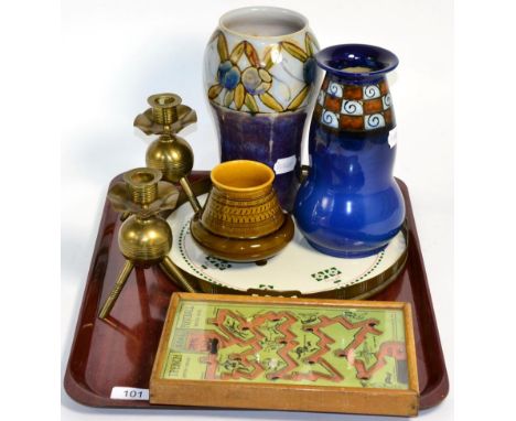 A Doulton dark blue and scroll decorated pattern vase; a Linthorpe small footed vase; a ceramic geometric pattern design copp
