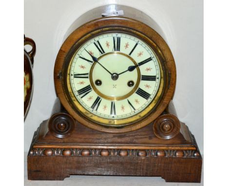 An oak striking mantel clock 