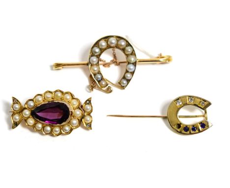 A sapphire and diamond horseshoe stickpin, a pearl set horseshoe bar brooch and a purple paste, pearl and diamond brooch, 16.