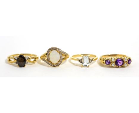 A 9 carat gold star sapphire and diamond ring, finger size R1/2, a 9 carat gold amethyst and pearl ring, a 9 carat gold opal 