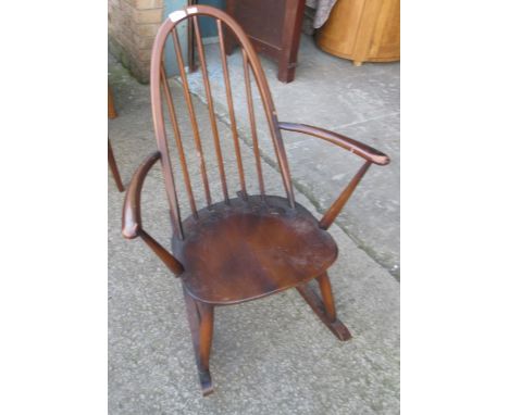 Small Ercol stick back rocking chair in dark wood finish 