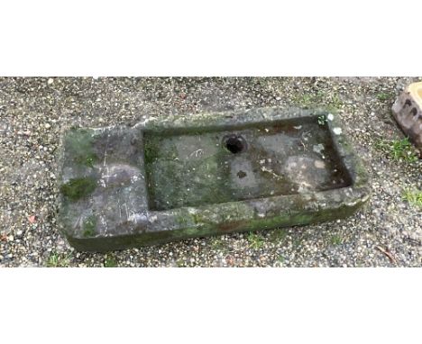 A stone carved butlers sink 104 x 44 approximately 14cm high 