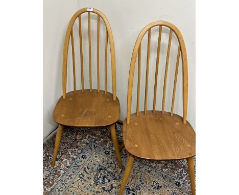 Two Ercol Quaker stick back dining chairs, H95cm, both with gold sticker 