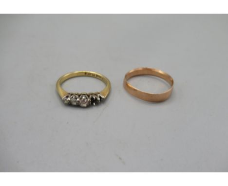 9ct yellow wedding band, stamped 375, size N, 1.3g, and an 18ct yellow gold ring set with 3 diamonds, stamped 18ct, A/F, size
