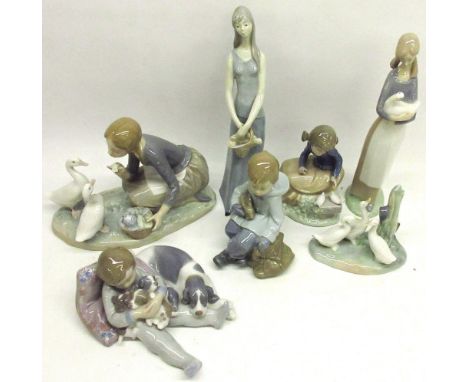 Collection of Lladro and Nao figures, incl. a girl feeding ducks, boy with puppies, etc. (7) 