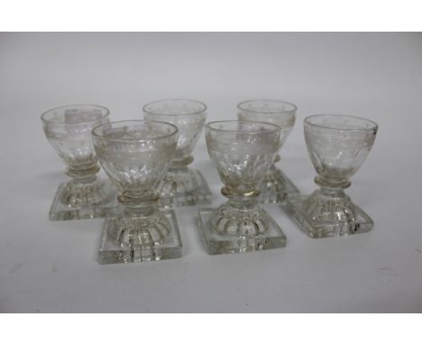 A SET OF SIX 19TH CENTURY SQUAT PORT GLASSES with moulded lemon squeezer bases and cut decoration to the bowls, 8.5cm high