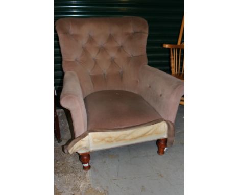 A LATE 19TH / EARLY 20TH CENTURY BUTTON UPHOLSTERED ARMCHAIR with turned tapering front legs, the rear legs legs stamped 'Sad