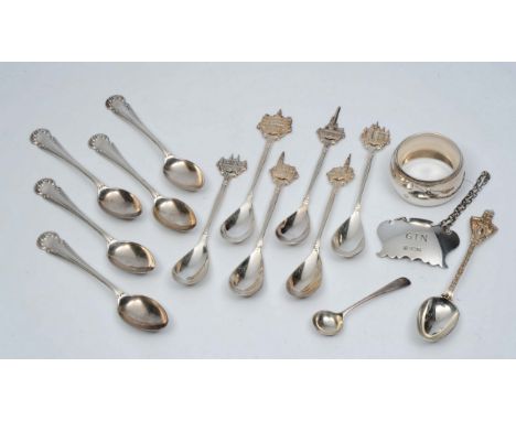 THIRTEEN VARIOUS SILVER TEASPOONS together with a silver decanter label marked Gin and a contemporary silver napkin ring