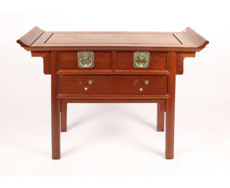A CHINESE HARDWOOD SIDE CABINET with panelled top and scroll ends above two short and one long drawer on splaying legs, 104cm
