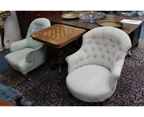A VICTORIAN BUTTON UPHOLSTERED TUB ARMCHAIR standing on carved mahogany feet terminating in castors 70cm wide together with a