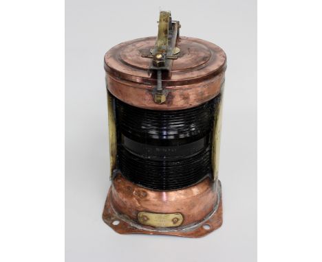 AN OLD COPPER AND BRASS CYLINDRICAL STERN LANTERN the brass plaque marked 'Stern' BT in a circle, 400 and NK 77, approximatel