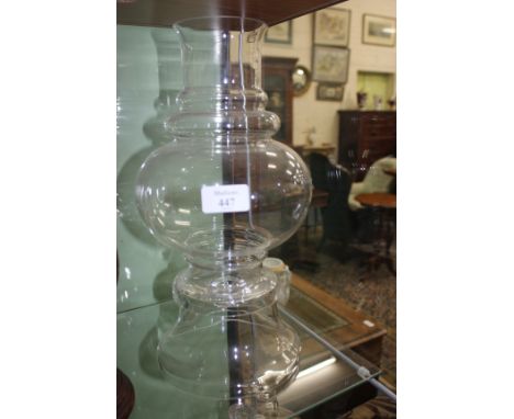 AN ORREFORS CLEAR GLASS TWO SECTIONAL HURRICANE LAMP of turned form, approximately 34cm tall