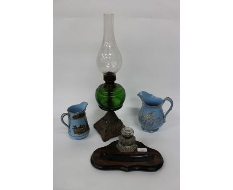 A 19TH CENTURY INK STAND with stained pine base and cut glass inkwell, 30cm wide together with a Victorian green glass oil la
