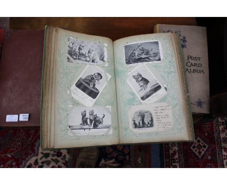 A LATE VICTORIAN POSTCARD ALBUM displaying a number of antique postcards of scenic views, a number from the Rotary series dep