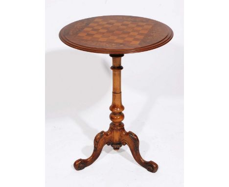 A VICTORIAN WALNUT CIRCULAR CHESS TABLE with floral inlay to the top on turned column support and carved tripod base 52cm dia
