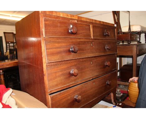 A 19TH CENTURY MAHOGANY CADDY TOP CHEST of two short and three long drawers with turned knob handles standing on bracket feet