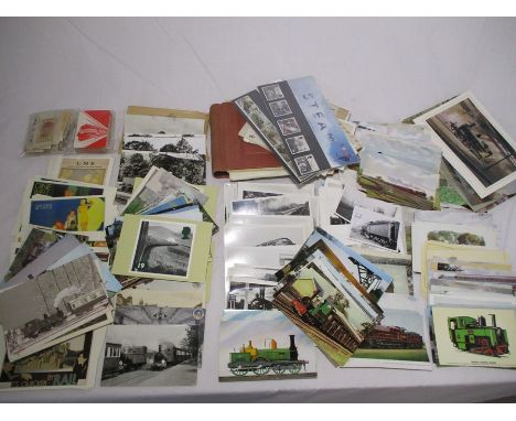 A collection of railway related items including a quantity of postcards, greetings cards and pictures, an album of world stam